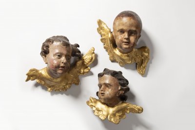 A CONVOLUTE OF THREE BAROQUE ANGEL HEADS