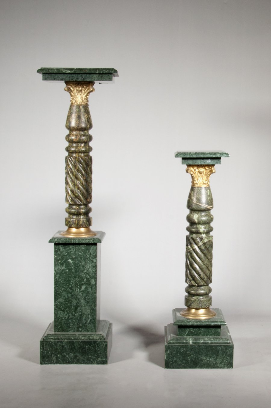 PAIRED COLUMN SHAPED PEDESTALS