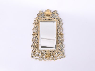 MIRROR IN A BRASS FRAME