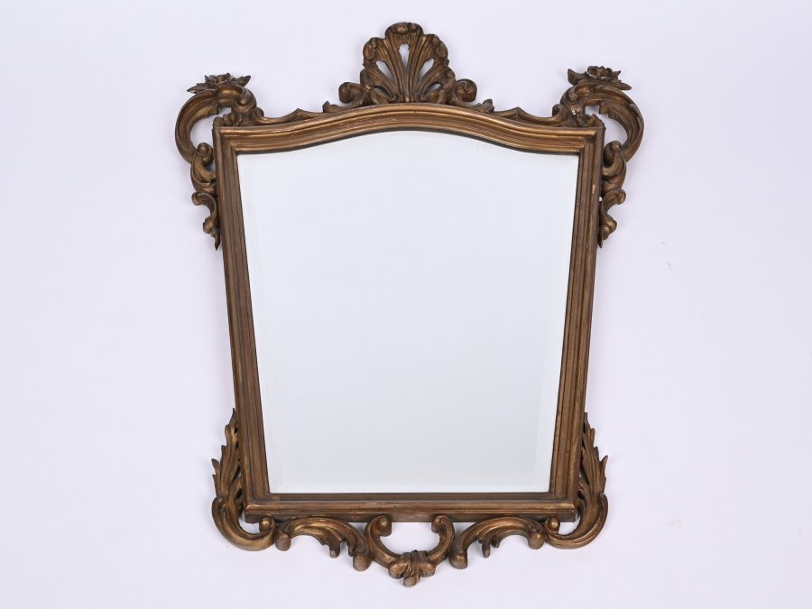 MIRROR IN THE FRAME WITH VOLUTES