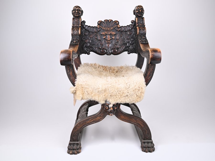 RICHLY CARVED RENAISSANCE STYLE ARMCHAIR