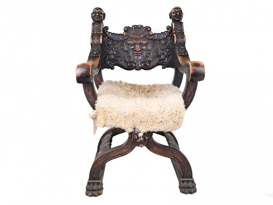 RICHLY CARVED RENAISSANCE STYLE ARMCHAIR