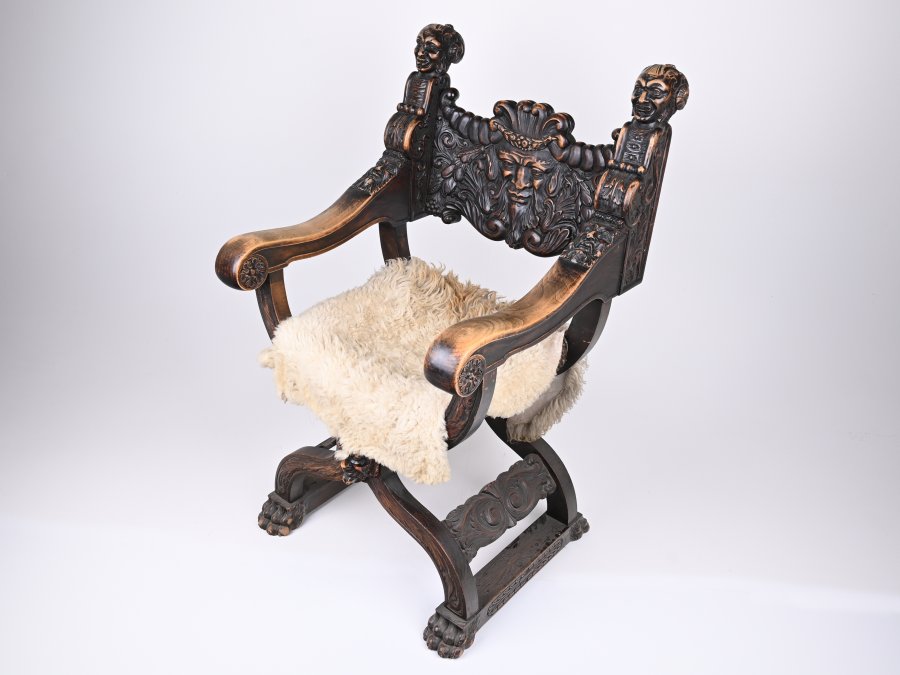 RICHLY CARVED RENAISSANCE STYLE ARMCHAIR
