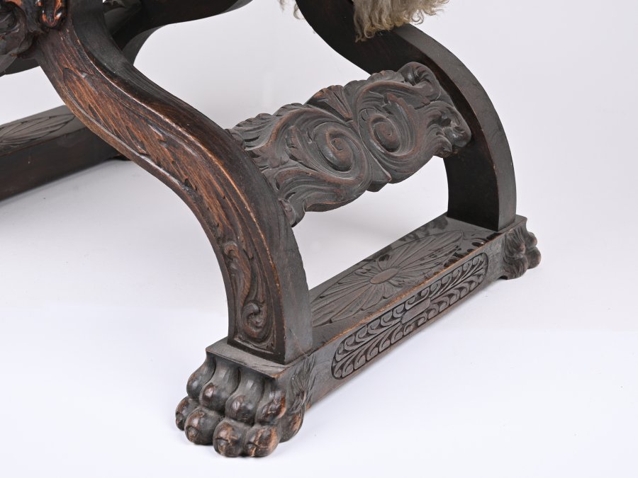 RICHLY CARVED RENAISSANCE STYLE ARMCHAIR