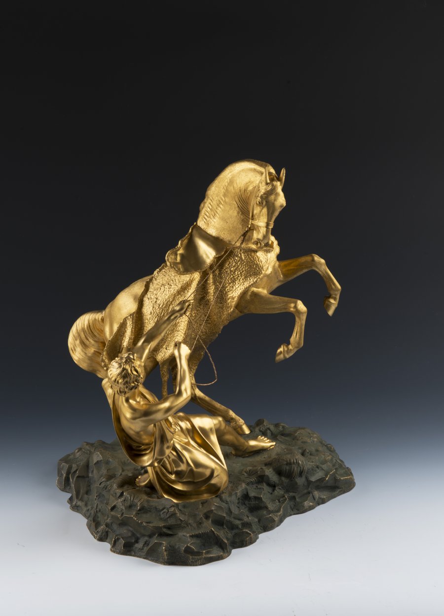 A PAIR OF BRONZE HORSE STATUES