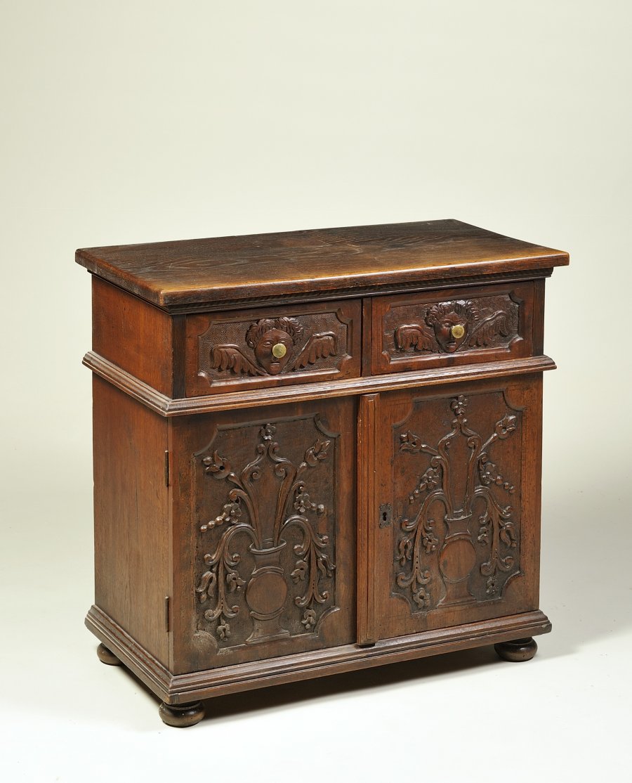 A SMALL OAK CABINET