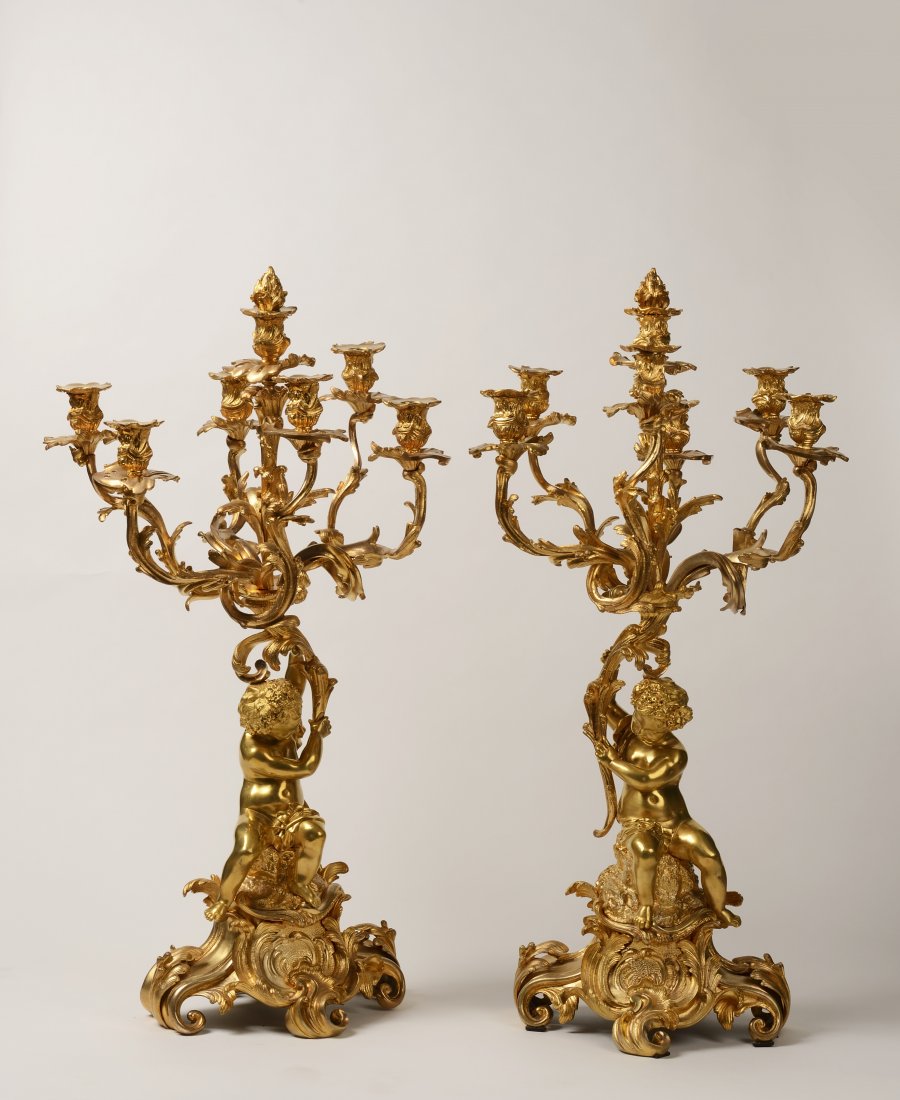 A Pair of Seven-Arm Candelabra with Putti