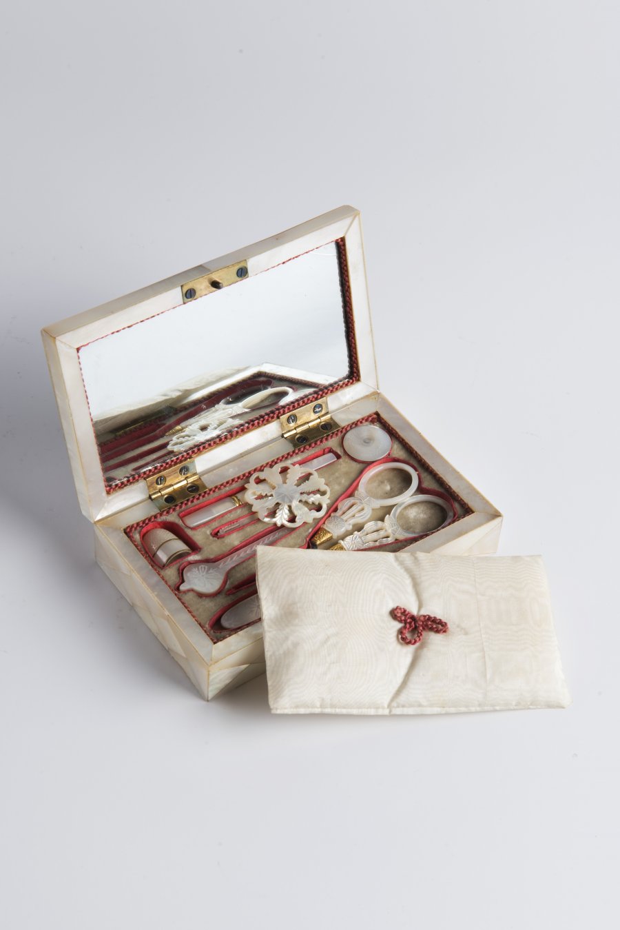 A SEWING NOTION BOX WITH A MINIATURE