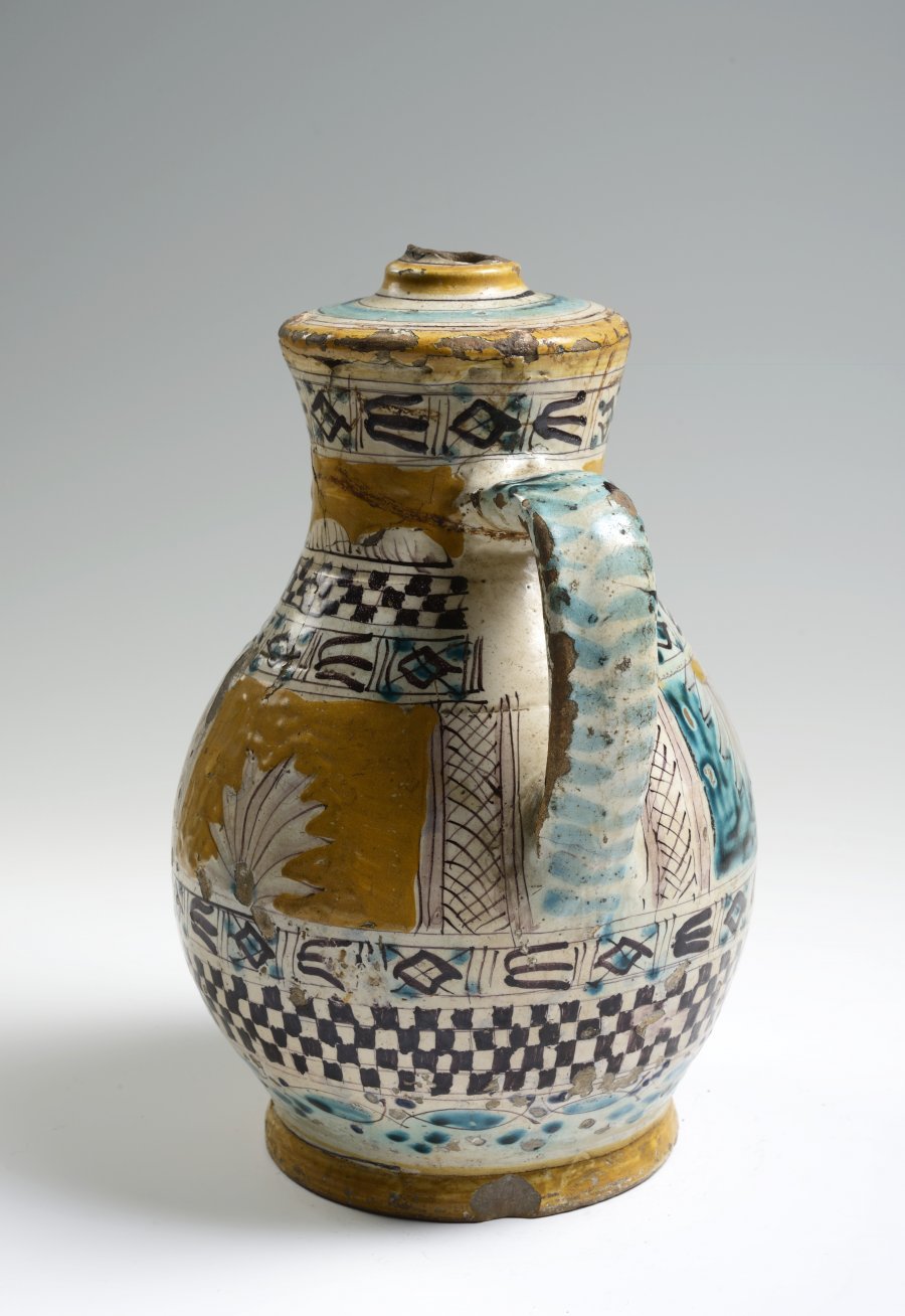 A NARROW MOUTH JUG (“OWL” STYLE)
