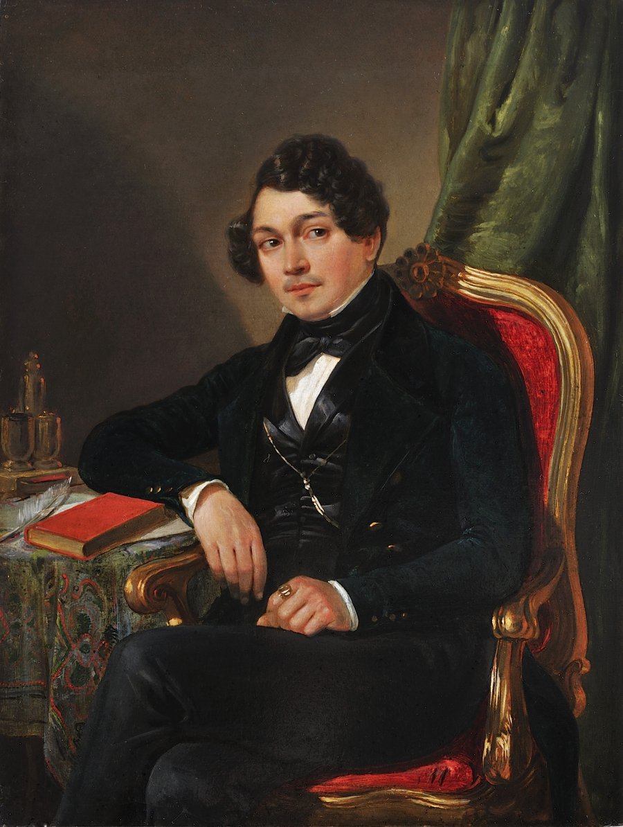 A PORTRAIT OF A MAN SEATED IN AN ARMCHAIR