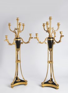 A PAIR OF EMPIRE STYLE CANDLE HOLDERS