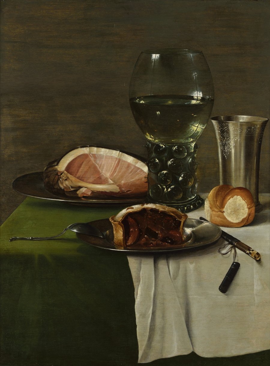 A STILL LIFE WITH A GLASS OF WHITE WINE, SILVER CUP AND FOOD