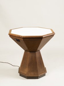 A CUBIST SIDE TABLE WITH A BACKLIT TABLETOP