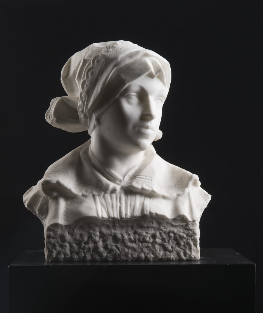 A BUST OF A GIRL IN FOLK COSTUME