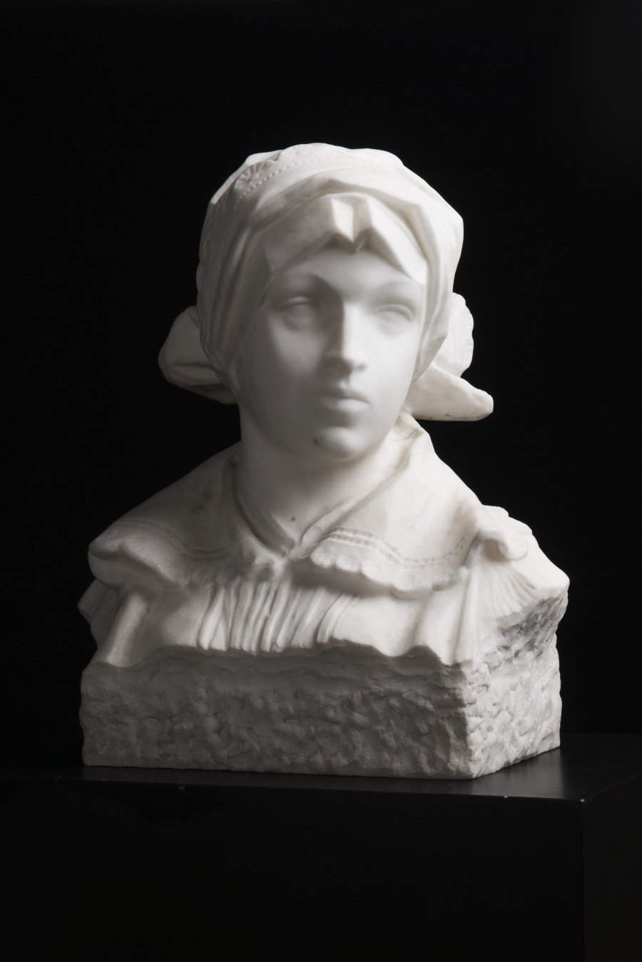 A BUST OF A GIRL IN FOLK COSTUME